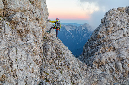 Europe, Italy, Veneto, Agordino, mountain climber on the via ferrata Stella Alpina at mount Agner, Pale di San Martino, Dolomites Photographie de stock - Rights-Managed, Code: 879-09190580