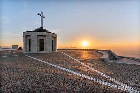 Monte Grappa, province of Vicenza, Veneto, Italy, Europe. On the summit of Monte Grappa there is a military memorial monument. The Sanctuary Madonna del Grappa at sunrise Photographie de stock - Rights-Managed, Code: 879-09190673