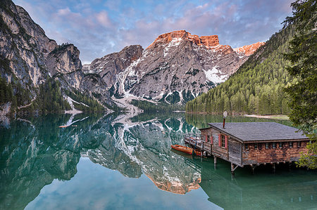 serene lake boat - Braies / Prags, Dolomites, South Tyrol, Italy. The Lake Braies / Pragser Wildsee at sunrise Stock Photo - Rights-Managed, Code: 879-09190688