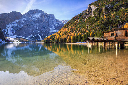 Colorful woods and peaks are reflected in Lake Braies Natural Park of Fanes Sennes Bolzano Trentino Alto Adige Italy Europe Photographie de stock - Rights-Managed, Code: 879-09191157