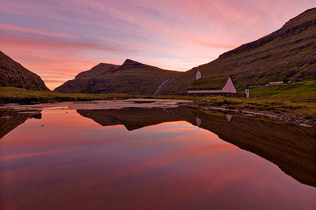 Pink sunset on church surrounded by water, Saksun, Streymoy Island, Faroe Islands Photographie de stock - Rights-Managed, Code: 879-09191180