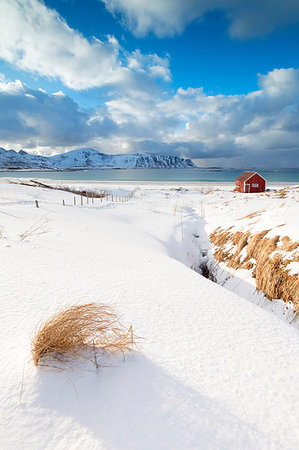 snowy cabin pictures - Snow surrounding the sandy beach, Ramberg, Flakstad municipality, Lofoten Islands, Norway Stock Photo - Rights-Managed, Code: 879-09191360