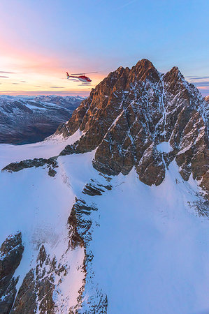 simsearch:879-09033982,k - Aerial view of helicopter in flight towards Piz Roseg at sunset, Bernina Group, border of Italy and Switzerland Photographie de stock - Rights-Managed, Code: 879-09191382