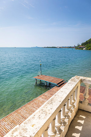 simsearch:879-09191749,k - sunny day on Garda Lake, view from a balcony. Toscolano Maderno, Brescia district, Lombardia, Italy Photographie de stock - Rights-Managed, Code: 879-09191750