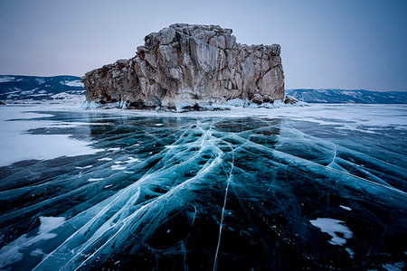 russia frozen lake - Ice cracks towards to an island at lake Baikal, Irkutsk region, Siberia, Russia Stock Photo - Rights-Managed, Code: 879-09191828