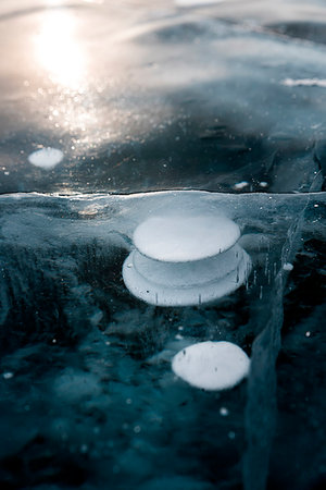 russia frozen lake - A bubbles of methane as a special form of the ice at lake Baikal, Irkutsk region, Siberia, Russia Stock Photo - Rights-Managed, Code: 879-09191838