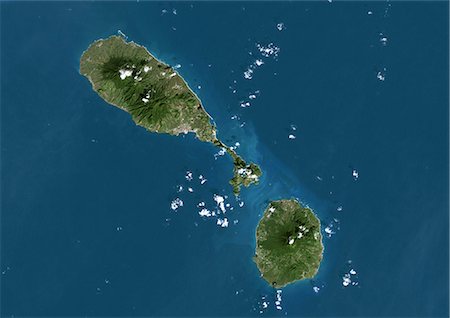 simsearch:872-06053329,k - Saint Kits et Nevis, True Image Satellite en couleurs. Saint Kitts and Nevis, image satellite couleur vraie. L'île principale (coin supérieur gauche) est le Saint-Christophe, dont la capitale que Basseterre situé sur la côte sud. La plus petite île de Nevis(bottom right) se trouve à environ 3 km au sud-est de Saint-Kitts. Cette image a été prise le 8 décembre 1999, par le satellite LANDSAT 7. Photographie de stock - Rights-Managed, Code: 872-06054049