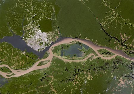 simsearch:872-06053794,k - Manaus, Brazil, True Colour Satellite Image. Manaus, Brazil. True colour satellite image of the city of Manaus. Composite of 2 images taken on 4 & 11 August 2001, using LANDSAT 7 data. Foto de stock - Con derechos protegidos, Código: 872-06052911