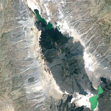 simsearch:872-06053066,k - Erta Ale Volcano, Ethiopia, True Colour Satellite Image. Erta Ale volcano, Ethiopia, true colour satellite image. Erta Ale (613m) is a shield volcano in the Afar region of East Africa. Image taken on 5 February 2002 using LANDSAT data. Print size 30 x 30 cm. Stock Photo - Rights-Managed, Code: 872-06053064