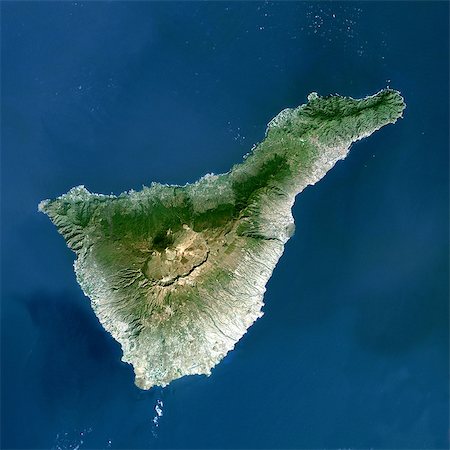 Teide Volcano, Canary Islands, Spain, True Colour Satellite Image. Teide volcano, Spain, true colour satellite image. Teide Volcano (3718 m) on the island of Tenerife in the Canary Islands is the highest peak in Spain. Composite image dated 2000-2001 using LANDSAT data. Print size 30 x 30 cm. Stock Photo - Rights-Managed, Code: 872-06053060