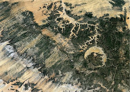 simsearch:872-06053131,k - Gweni Fada Meteor Impact Crater, Chad, True Colour Satellite Image. True colour satellite image of Gweni-Fada impact structure, Chad (diameter : 14 km). Image taken on 19 January 1987 using LANDSAT data. Fotografie stock - Rights-Managed, Codice: 872-06053123