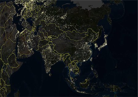 Asia At Night With Country Borders, True Colour Satellite Image. True colour satellite image of Asia at night with country borders. This image in Lambert Azimuthal Equal Area projection was compiled from data acquired by LANDSAT 5 & 7 satellites. Stock Photo - Rights-Managed, Code: 872-06053635