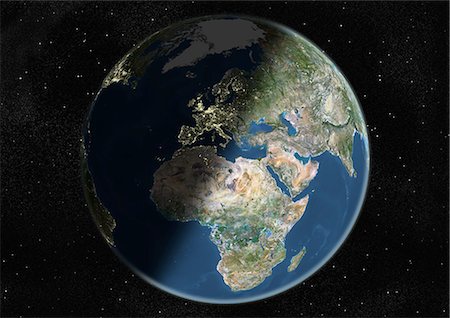 Monde centré sur l'Europe et l'Afrique, True Image Satellite en couleurs. Image satellite de véritable couleur de la terre centrée sur l'Europe et l'Afrique, pendant le solstice d'hiver, à 6 heures GMT. Cette image dans une projection orthographique a été compilée à partir de données acquises par les satellites LANDSAT 5 & 7. Photographie de stock - Rights-Managed, Code: 872-06053700