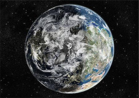 Monde centré sur le pôle Nord, True Image Satellite en couleurs. Image satellite de véritable couleur de la terre centrée sur le pôle Nord avec la couverture nuageuse, durant le solstice d'hiver, à 6 heures GMT. Cette image dans une projection orthographique a été compilée à partir de données acquises par les satellites LANDSAT 5 & 7. Photographie de stock - Rights-Managed, Code: 872-06053725