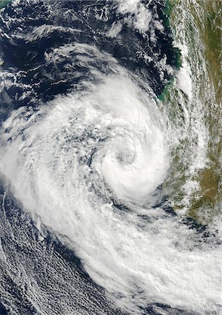 Cyclone Izilda, Madagascar, Africa, In 2009, True Colour Satellite Image. Cyclone Izilda in the Mozambique Channel off the coast of Southern Magadascar on 25 March 2009. True-colour satellite image using MODIS data. Foto de stock - Con derechos protegidos, Código: 872-06053826