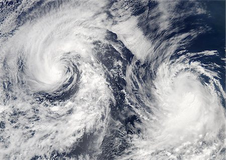 destruction of hurricanes - Tropical Storms Boris And Cristina, Pacific Ocean, In 2008, True Colour Satellite Image. Tropical storms Boris and Cristina on 28 June 2008 over the Pacific ocean. True-colour satellite image using MODIS data. Stock Photo - Rights-Managed, Code: 872-06053863