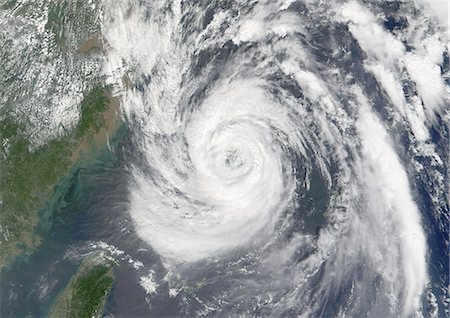 severe - Typhoon Nari, Taiwan, China, Asia, In 2001, True Colour Satellite Image. Typhoon Nari in September 2001 northeast of Taiwan and west of Shanghai, China. True-colour satellite image using MODIS data. Stock Photo - Rights-Managed, Code: 872-06053871