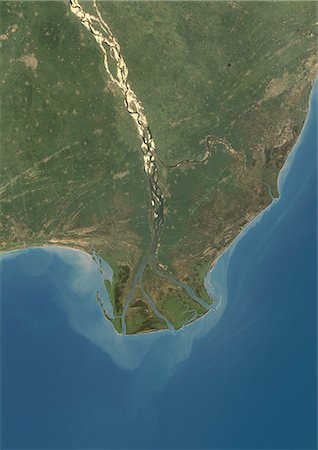 simsearch:872-06053522,k - Krishna River Delta, India, True Colour Satellite Image. True colour satellite image of Krishna River Delta in India. The Krishna River flows into the Bay of Bengal. Composite image using LANDSAT 7 data. Stock Photo - Rights-Managed, Code: 872-06053927