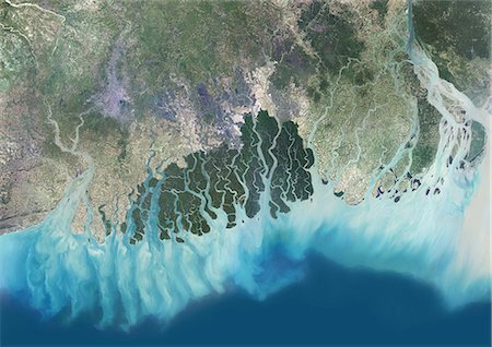 simsearch:872-08689427,k - Satellite view of the Ganges River Delta, Bangladesh, India. Also known as the Brahmaputra Delta, it empties into the Bay of Bengal. Kolkata sits within the lower Ganges Delta along the Hooghly River (at west on the image). This image was compiled from data acquired in 2014 by Landsat 8 satellite. Stock Photo - Rights-Managed, Code: 872-08689437
