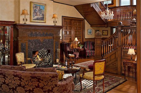 simsearch:872-08914934,k - Living room with fireplace and wooden staircase, Albemarle Inn, Asheville, NC. Stock Photo - Rights-Managed, Code: 872-08914925