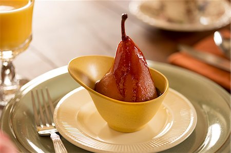 simsearch:872-08915093,k - Poached pear in a yellow cup, Olde Rhinebeck Inn, Rhinebeck, NY. Photographie de stock - Rights-Managed, Code: 872-08915005