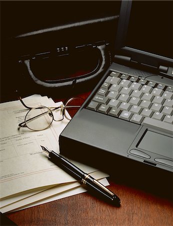 financial technology corporate - Laptop Computer, Briefcase, Pen Eyeglasses and Shares Stock Photo - Rights-Managed, Code: 873-06440313