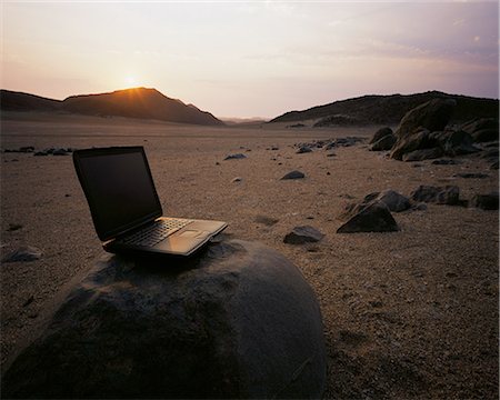 Laptop Computer on Rock at Dusk Messum Crater, Brandberg Area Namibia, Africa Foto de stock - Con derechos protegidos, Código: 873-06440450
