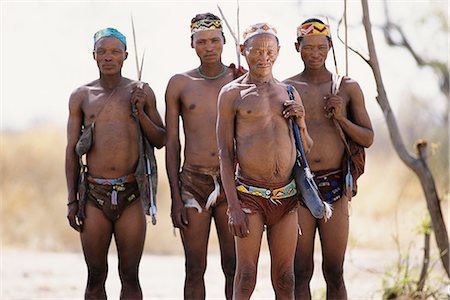 Portrait of Bushman Hunters with Bows, Arrows and Quivers Outdoors Namibia, Africa Foto de stock - Con derechos protegidos, Código: 873-06440561