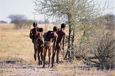 Vue arrière des chasseurs Bushman près d'arbres Namibie, Afrique Photographie de stock - Rights-Managed, Code: 873-06440570