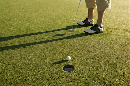 simsearch:6122-07694533,k - Man Putting on Golf Green Stock Photo - Rights-Managed, Code: 873-06441032