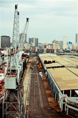 durban - Superstructure cranes next to a warehouse, Durban Harbor Fotografie stock - Rights-Managed, Codice: 873-06675245